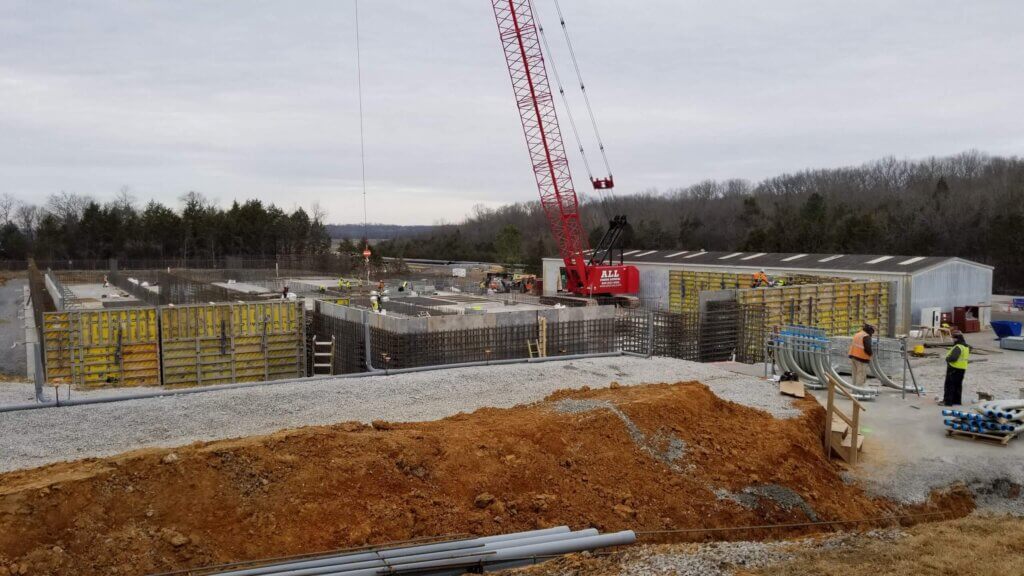 Scenery of red crane constructing building
